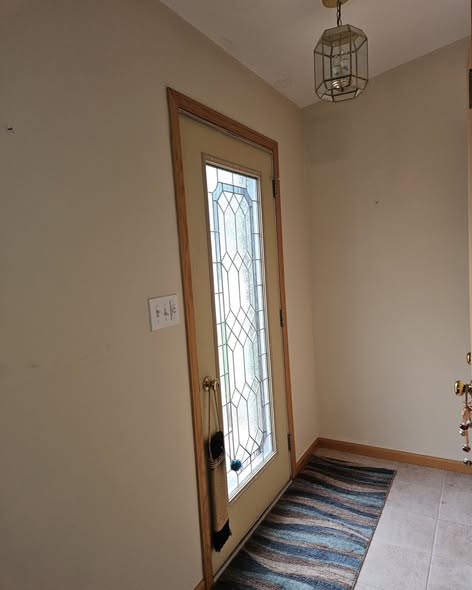 Entryway before with beige walls